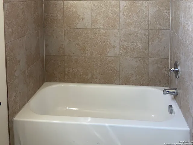 a bathroom with a bathtub
