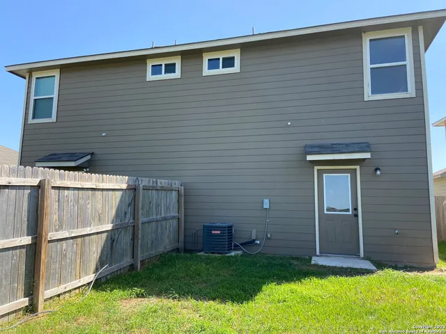 a view of front door of house and yard