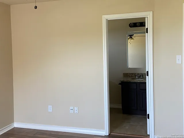 a view of a bathroom from the hallway