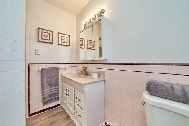 a bedroom with a bed table and window