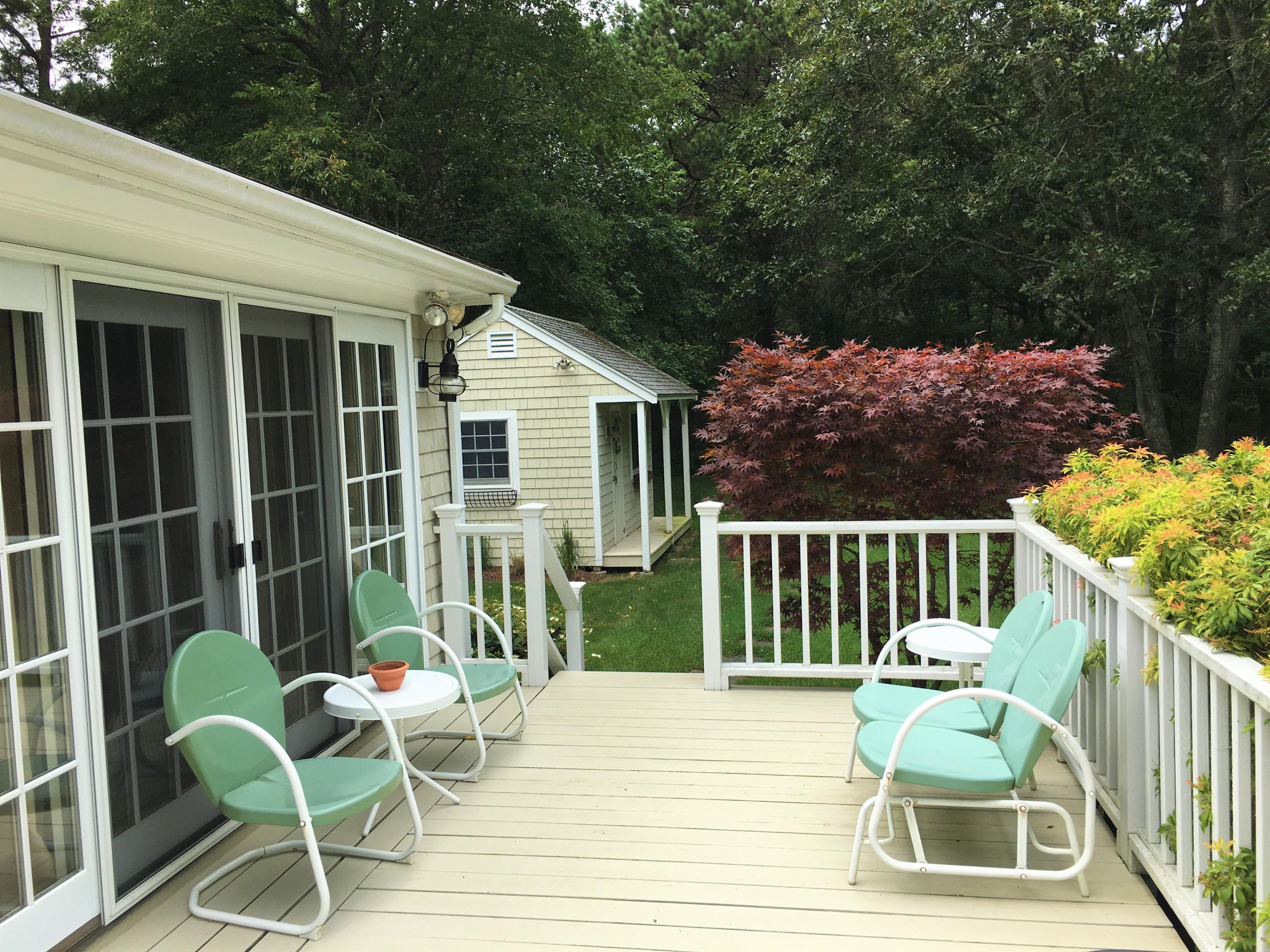 112 3rd Street North Edgartown, MA 02539 - Photo 3 of 15 a view of a chair and table in the balcony