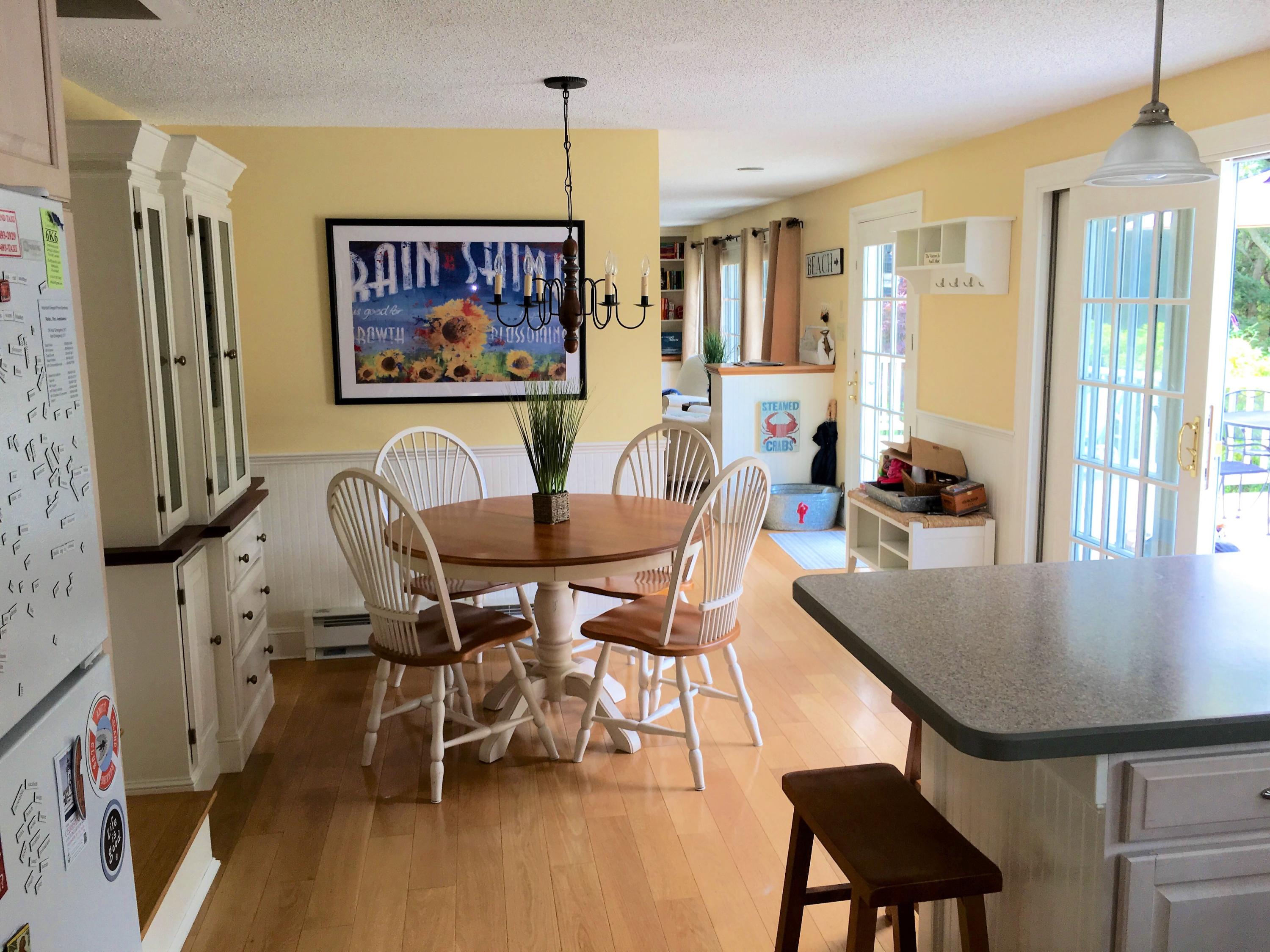 112 3rd Street North Edgartown, MA 02539 - Photo 4 of 15 a view of a dining room with furniture window and wooden floor