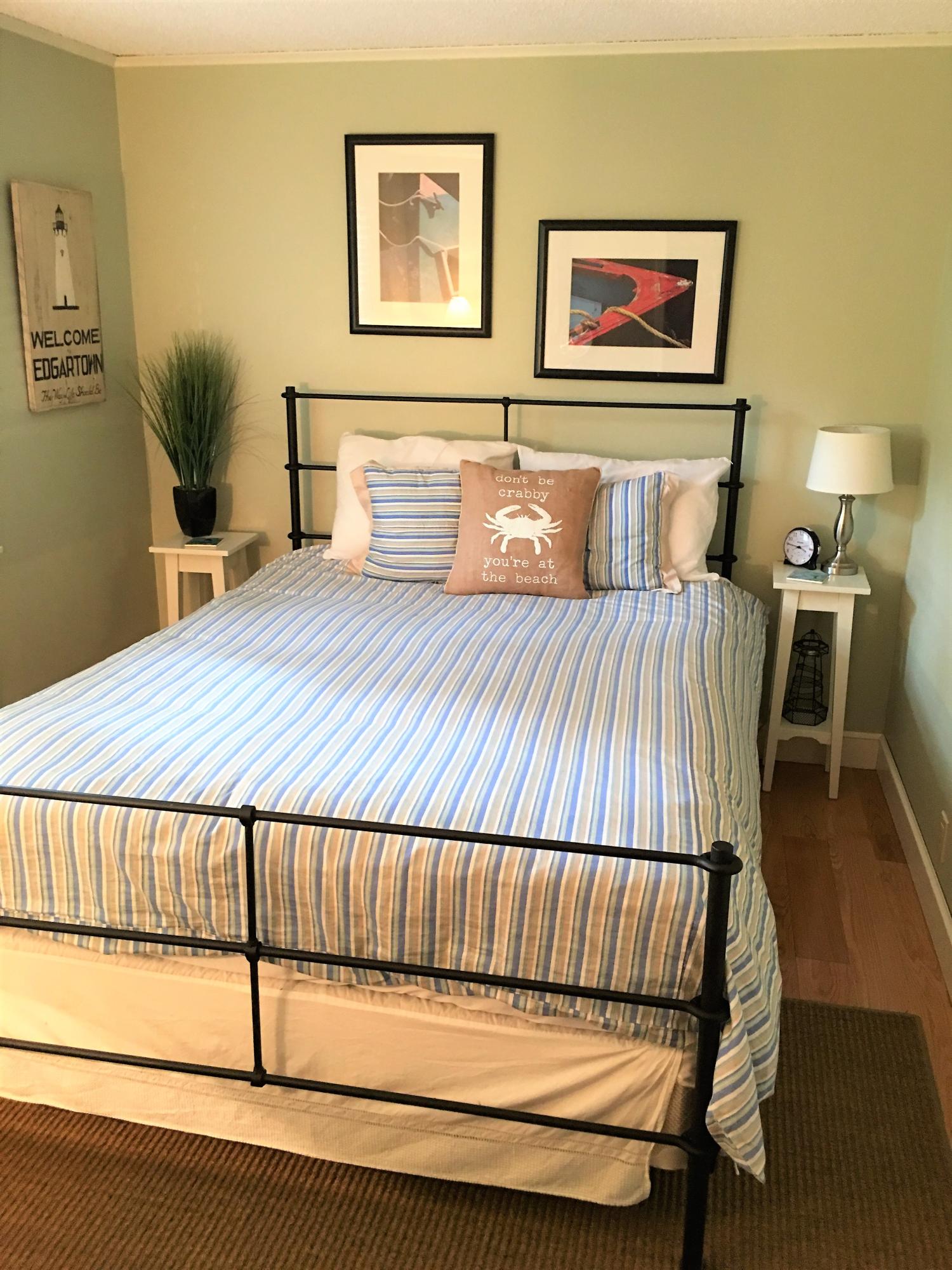 112 3rd Street North Edgartown, MA 02539 - Photo 10 of 15 a bedroom with a bed and wooden floor