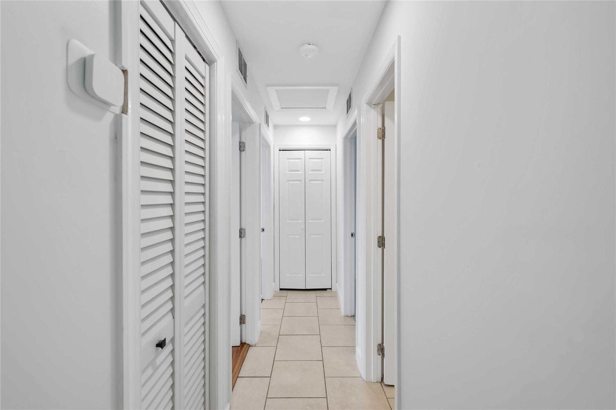 413 Philadelphia Drive Jupiter, FL 33458 - Photo 13 of 35 a view of a bathroom from a hallway