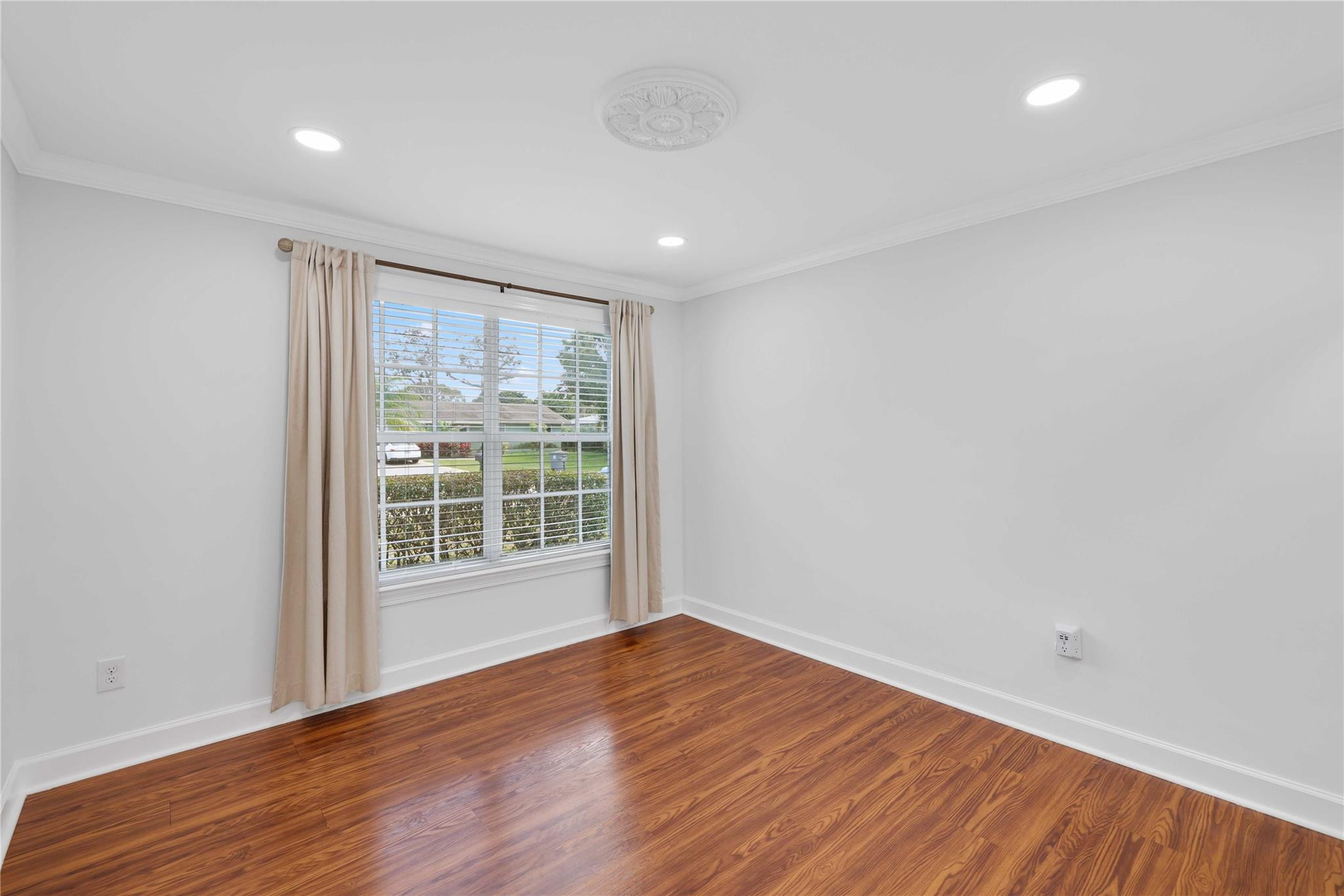 413 Philadelphia Drive Jupiter, FL 33458 - Photo 20 of 35 a view of empty room with wooden floor and fan