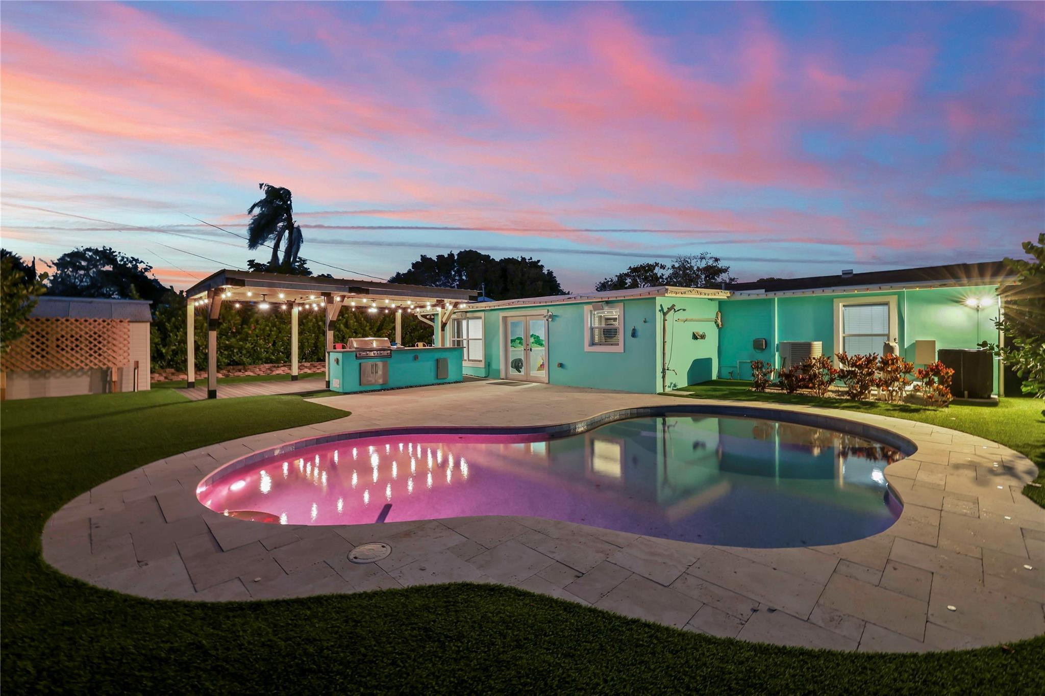 413 Philadelphia Drive Jupiter, FL 33458 - Photo 2 of 35 a view of swimming pool is middle and green field