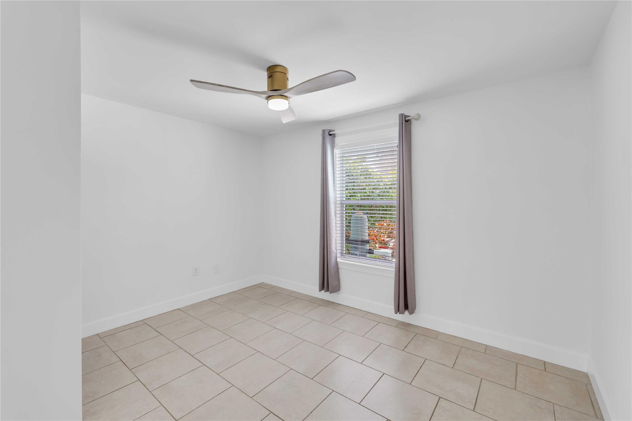 413 Philadelphia Drive Jupiter, FL 33458 - Photo 21 of 35 an empty room with entrance and windows