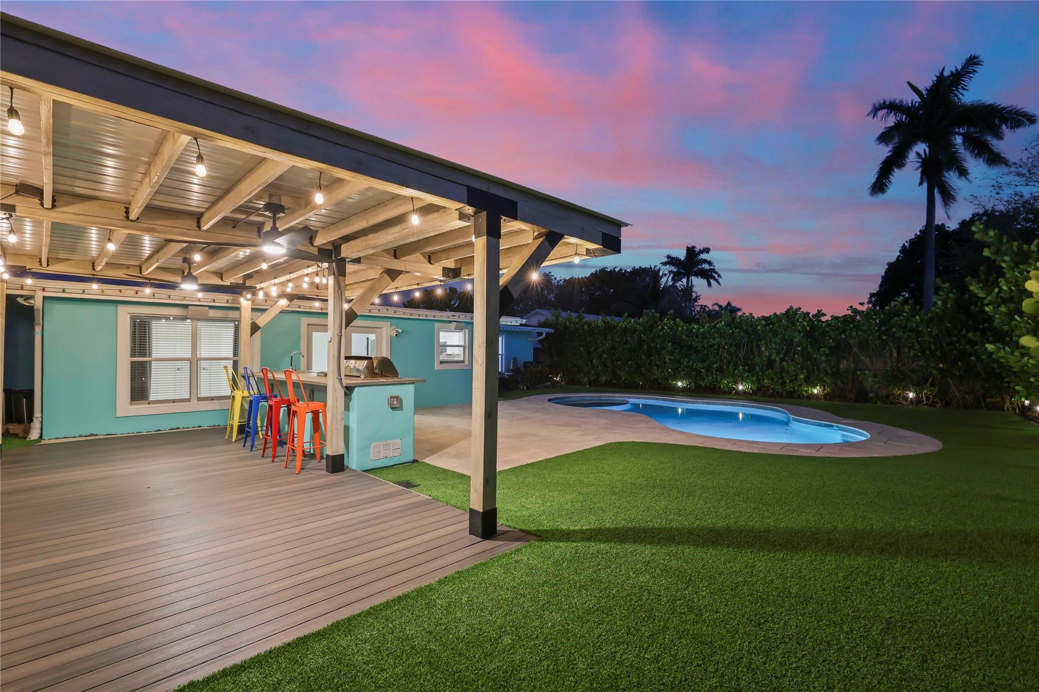413 Philadelphia Drive Jupiter, FL 33458 - Photo 27 of 35 a view of a house with swimming pool and porch
