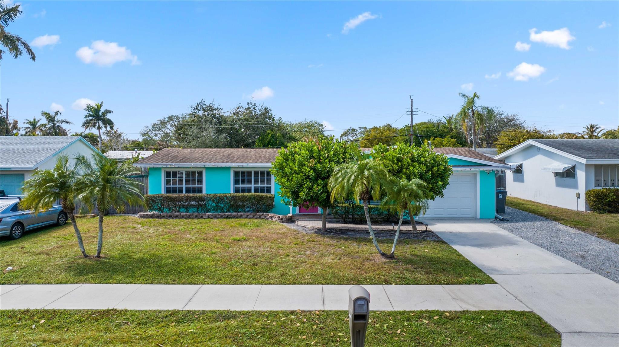 413 Philadelphia Drive Jupiter, FL 33458 - Photo 3 of 35 a view of a house with a yard