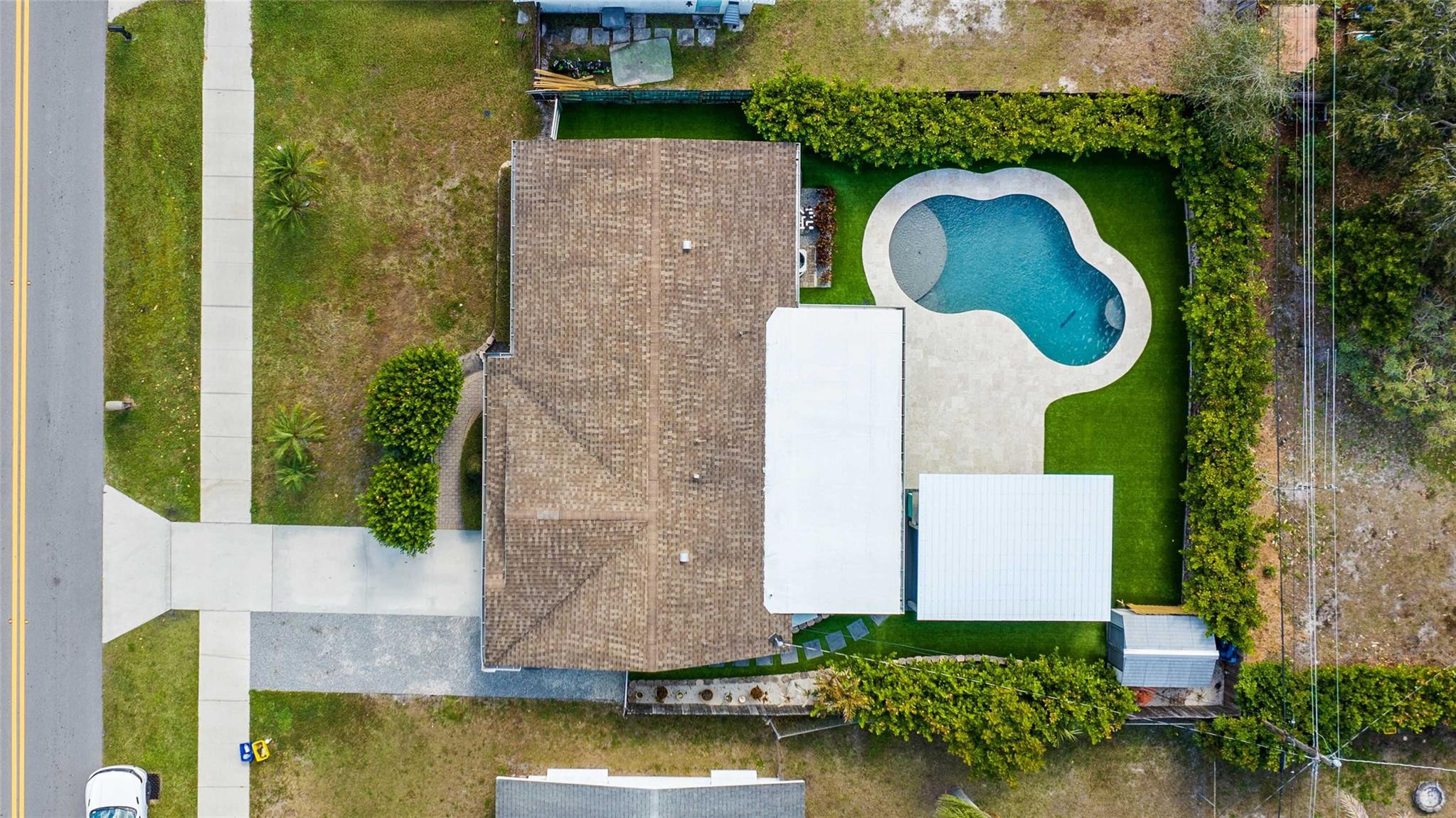 413 Philadelphia Drive Jupiter, FL 33458 - Photo 32 of 35 an aerial view of a house with swimming pool and garden