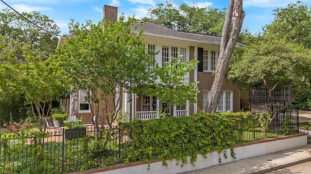front view of a house with a garden