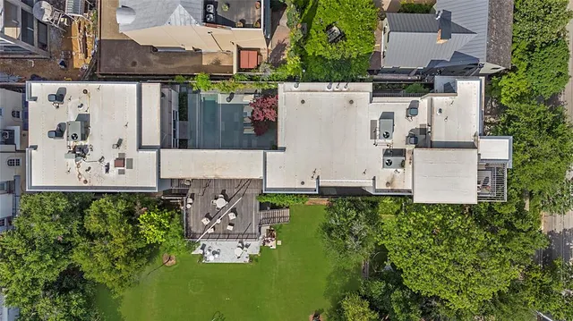 an aerial view of residential house with outdoor space and parking