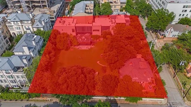 an aerial view of residential houses with yard