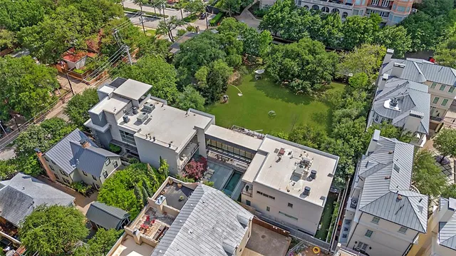 an aerial view of a house with outdoor space and street view