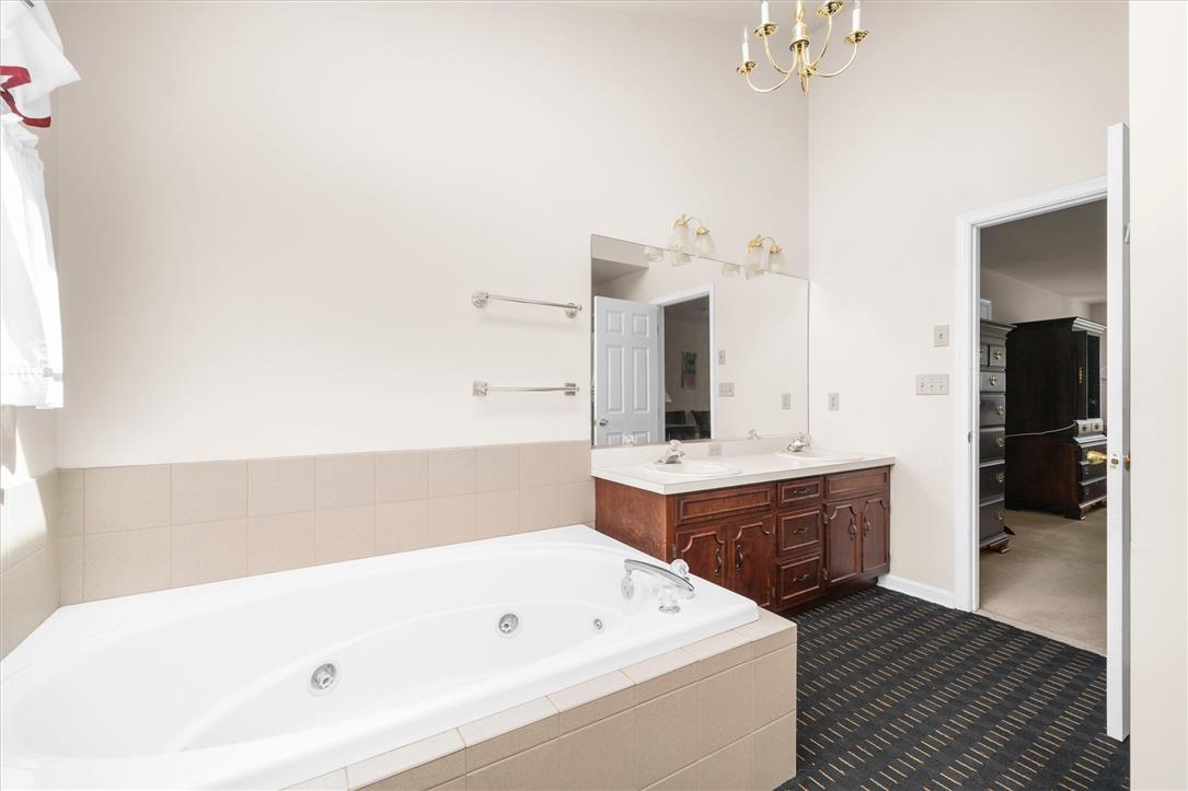1255 Spring Road Easton, PA 18040 - Photo 14 of 23 A spacious bathroom features a large soaking tub and a classic double vanity.