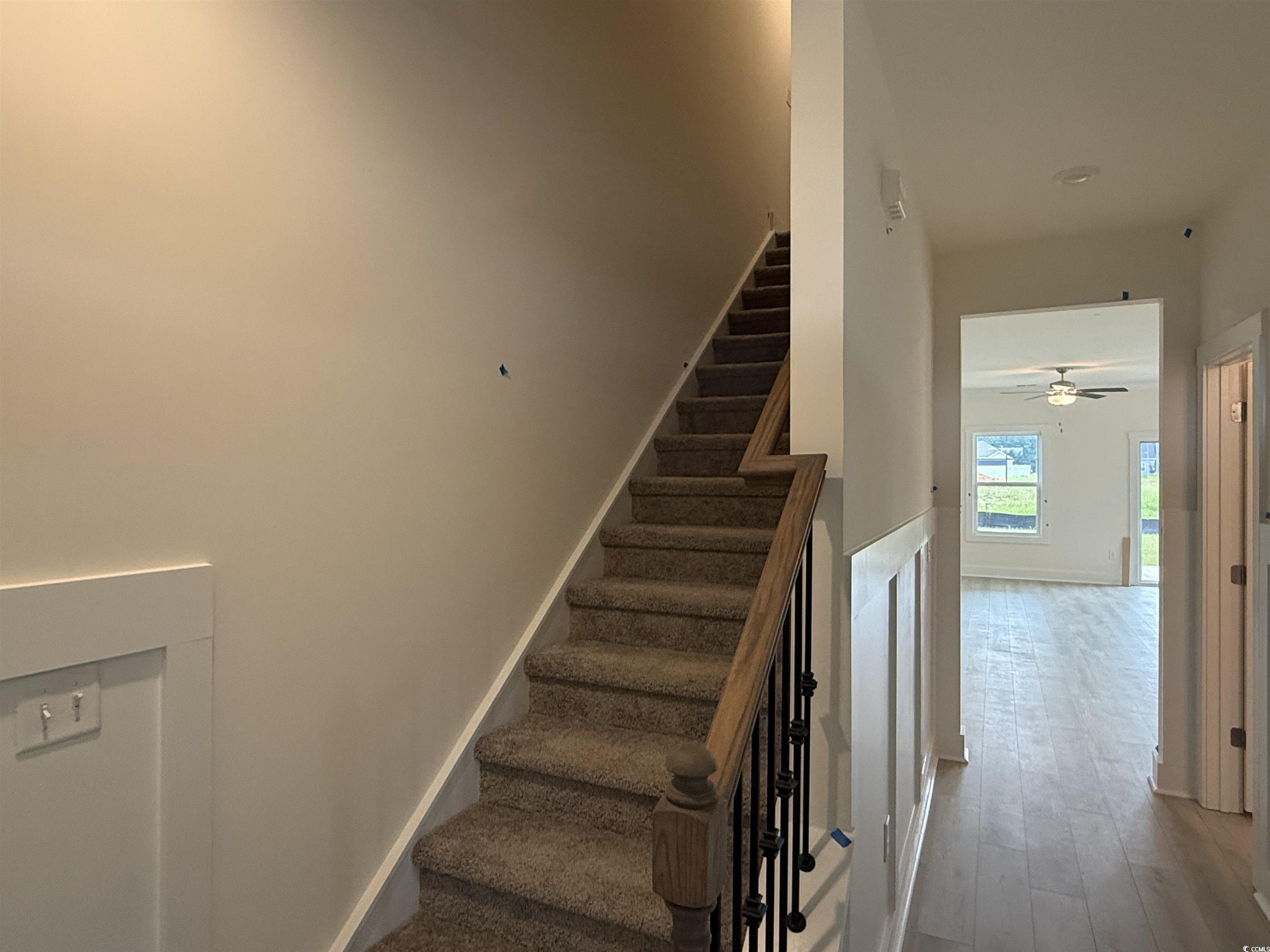 1045 Jase Drive Longs, SC 29568 - Photo 18 of 33 Staircase with ceiling fan and wood finished floors