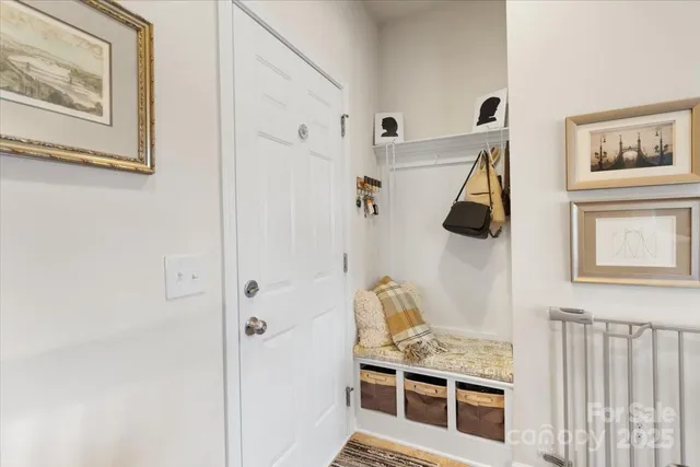 a view of a bedroom with furniture and window