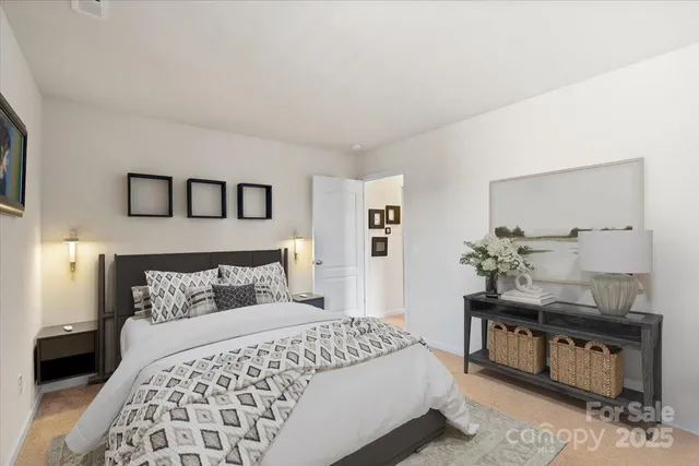 a bedroom with a bed and a lamp on table