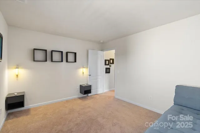 a view of a livingroom with a refrigerator