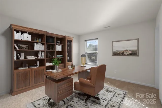 a view of workspace with furniture and window