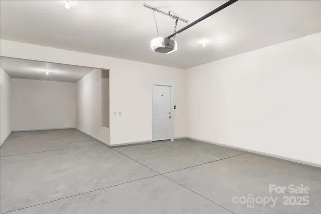 a view of a room with white walls