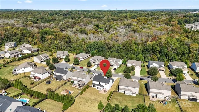 an aerial view of residential houses with outdoor space