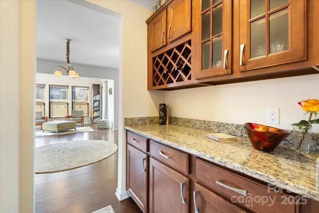 a kitchen with stainless steel appliances granite countertop a sink and cabinets