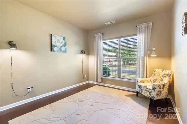 a bedroom with bed and window