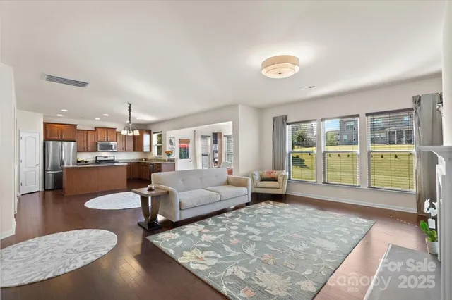 a living room with furniture and a table