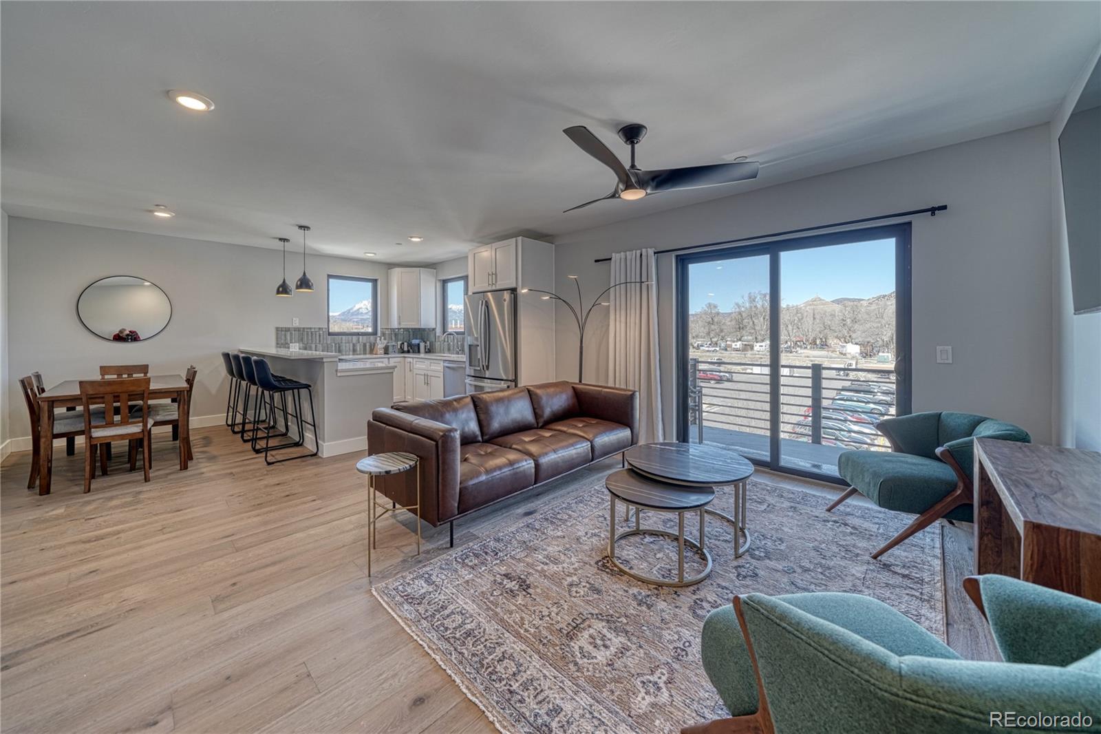 136 Old Stage Road, Unit 1E Salida, CO 81201 - Photo 13 of 26 a living room with furniture and a large window