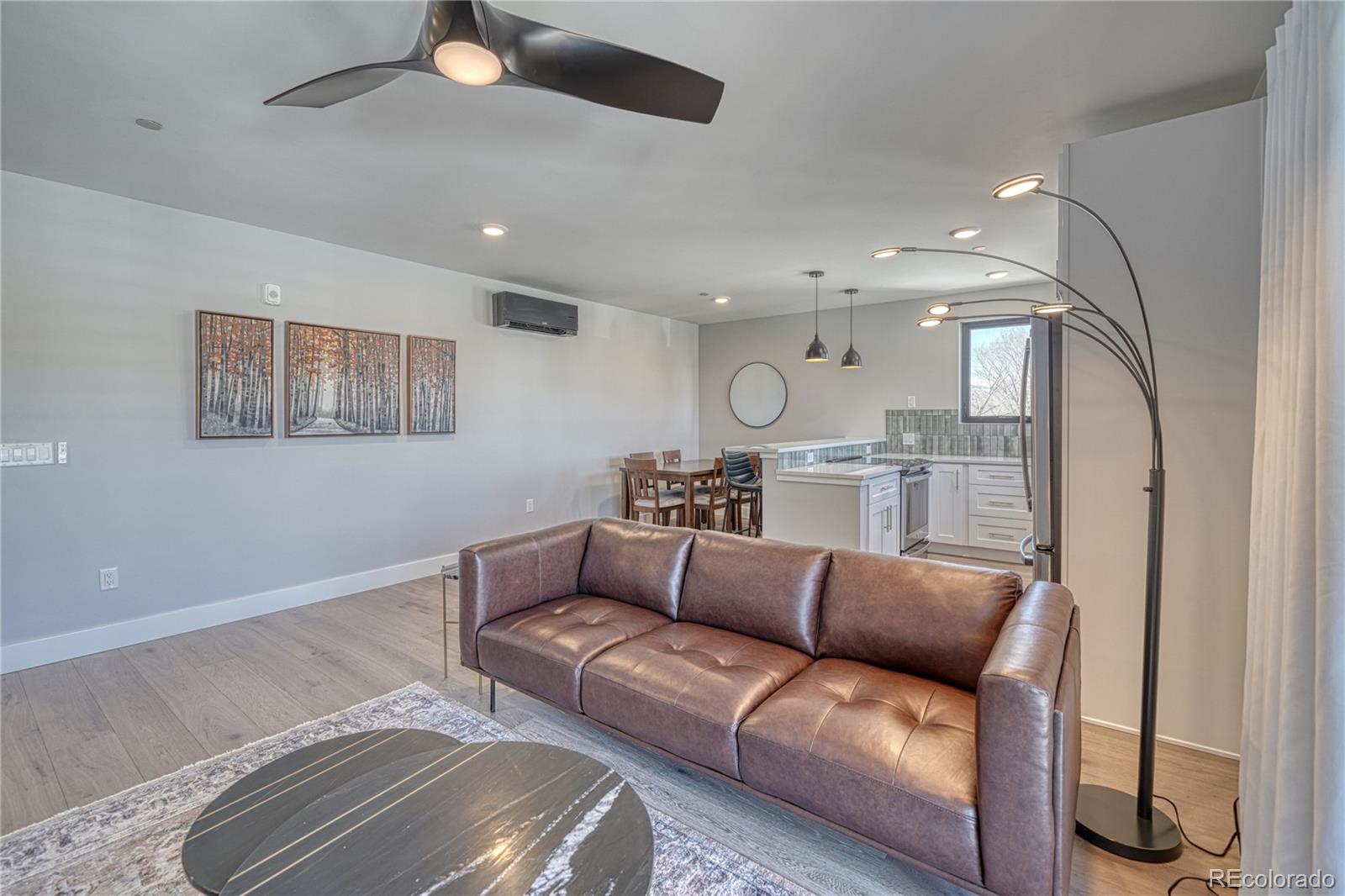 136 Old Stage Road, Unit 1E Salida, CO 81201 - Photo 18 of 26 a living room with furniture and a view of kitchen