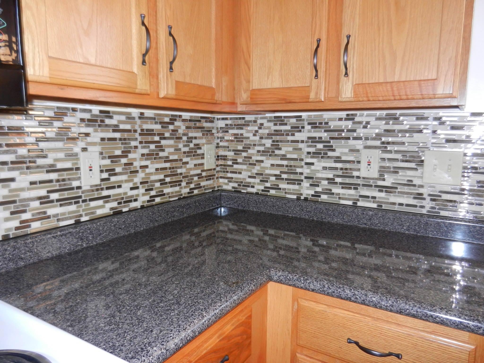 5867 Rothrock Court Galloway, OH 43119 - Photo 27 of 57 Rubbed Bronze new pulls on the oak cabinets to tie in with the new countertops and backsplash and stainless steel/black appliances.