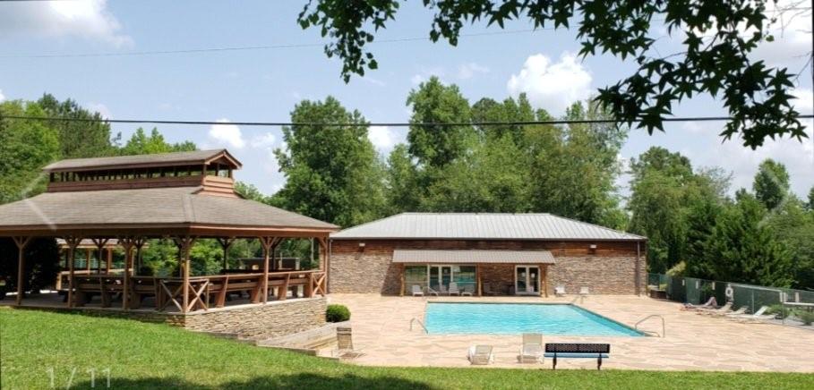 561 Parable Court Ranger, GA 30734 - Photo 5 of 10 an outdoor space with furniture and umbrella