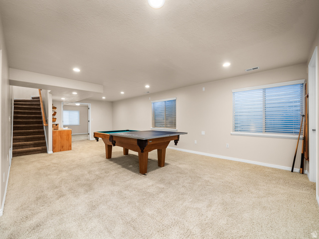 1602 Renaissance Way Springville, UT 84663 - Photo 24 of 42 Spacious lower-level room featuring light-toned carpeting, recessed ceiling lighting, and two windows with blinds