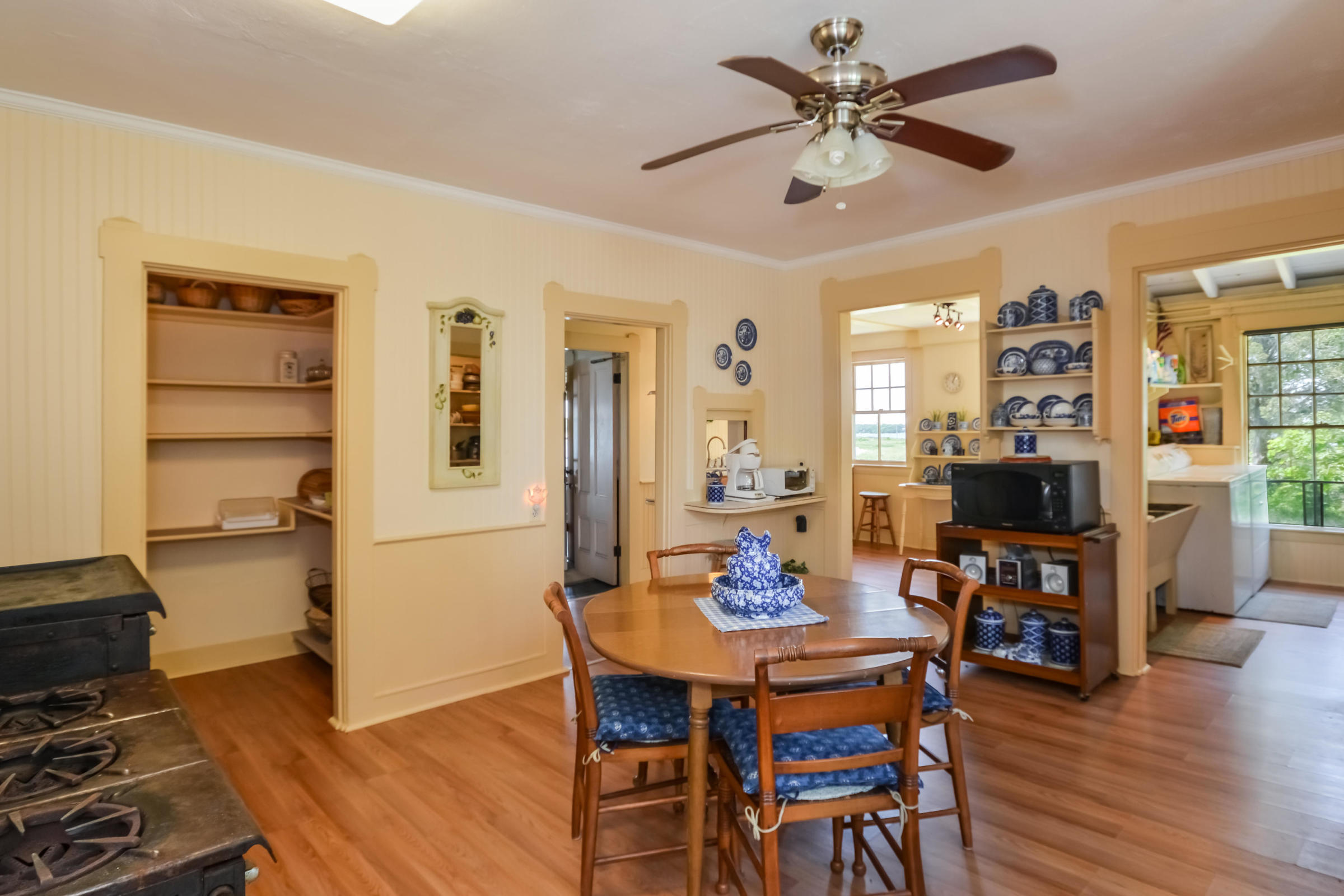 96 Rocky Point Road Bourne, MA 02532 - Photo 14 of 28 a view of a dining room with furniture and wooden floor