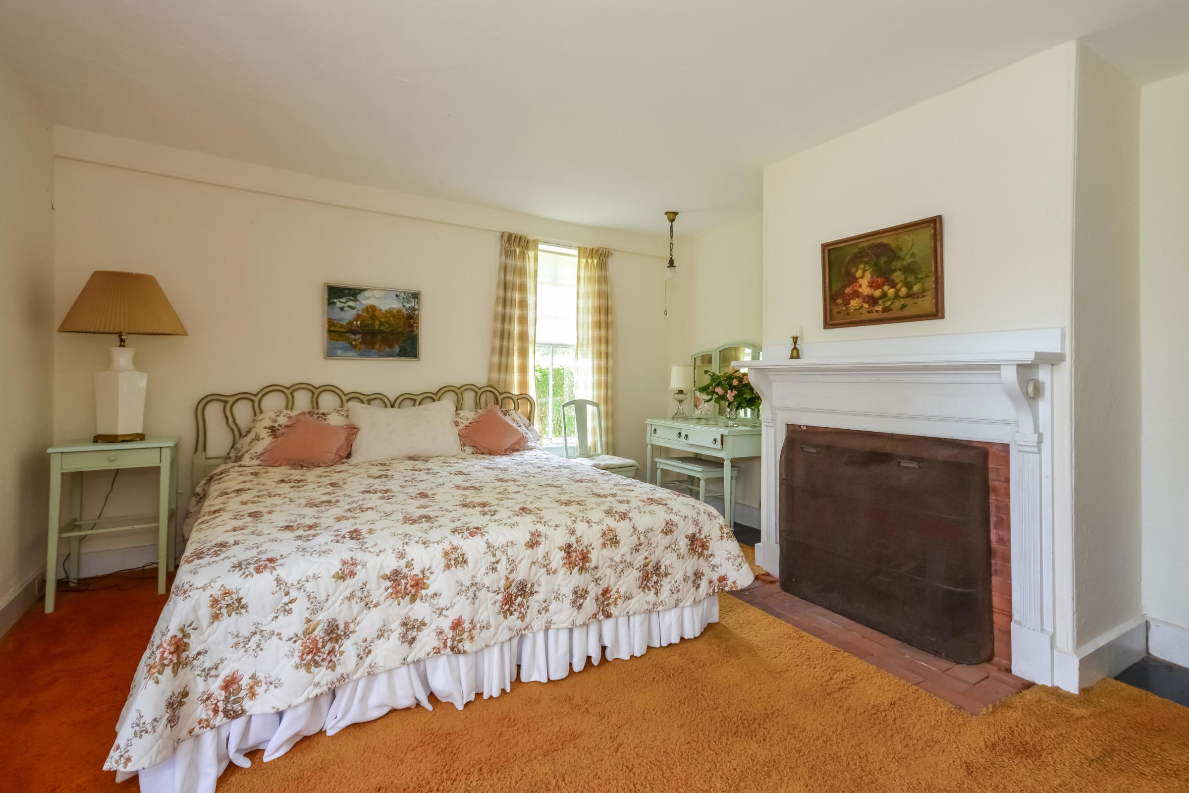 96 Rocky Point Road Bourne, MA 02532 - Photo 19 of 28 a bedroom with a bed and a fireplace