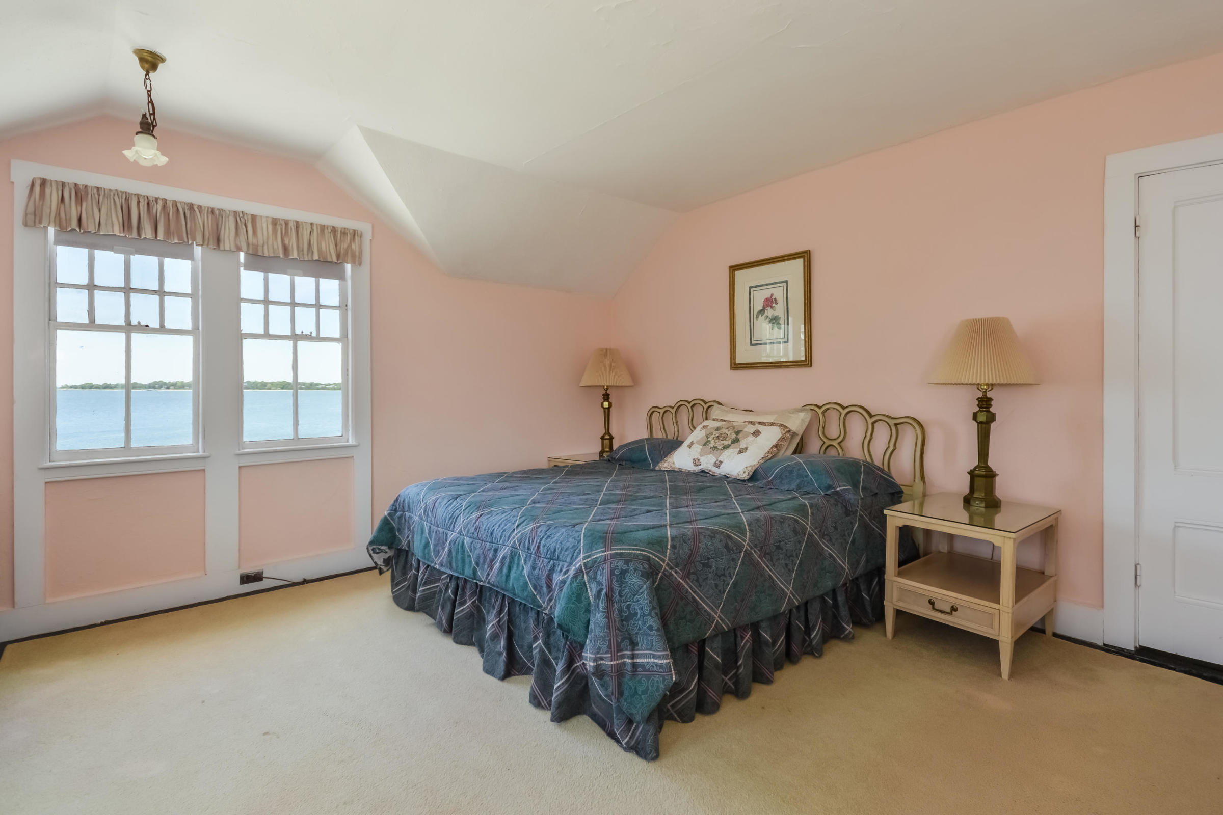 96 Rocky Point Road Bourne, MA 02532 - Photo 22 of 28 a bedroom with a bed dresser and a window