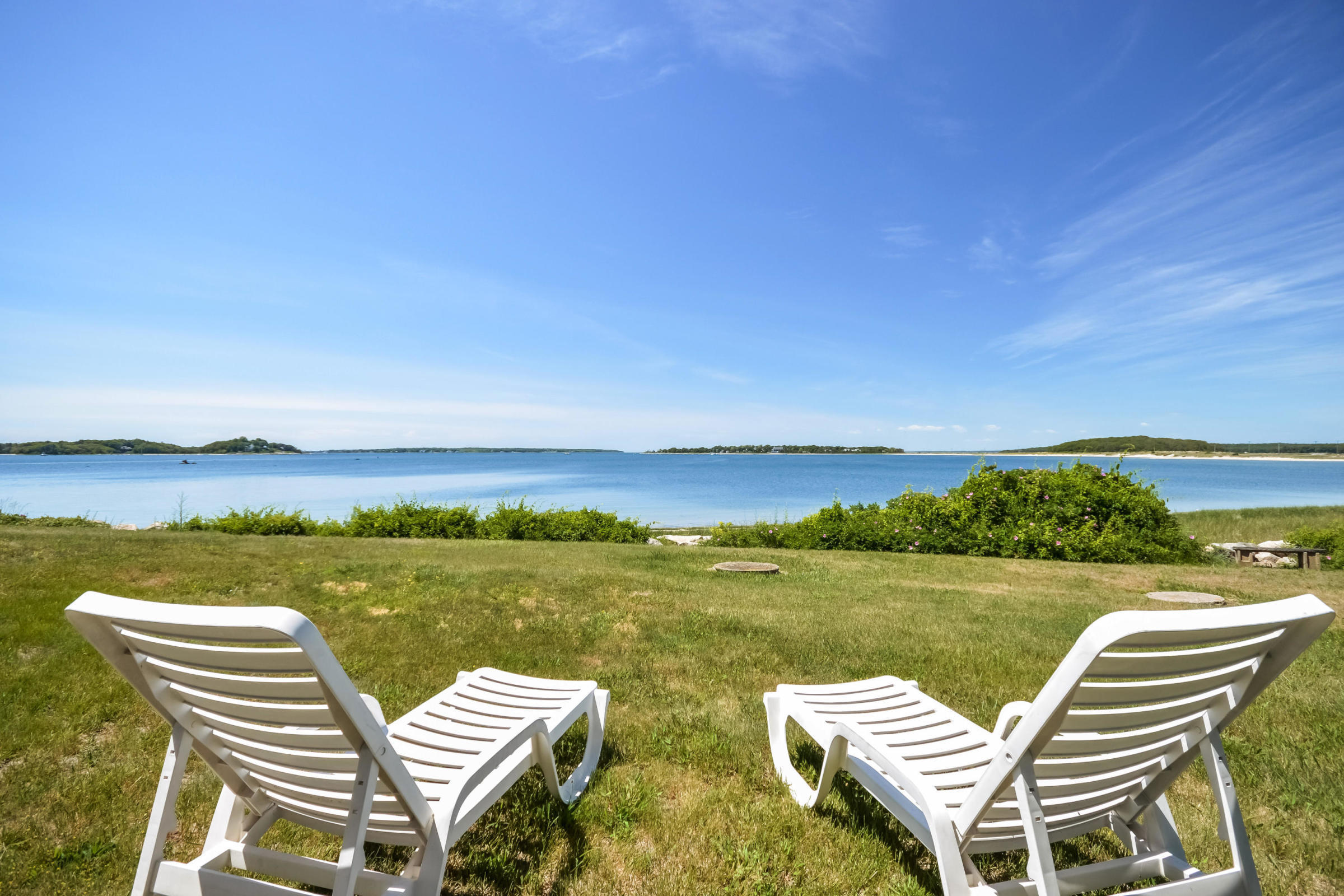 96 Rocky Point Road Bourne, MA 02532 - Photo 26 of 28 a view of a lake with chairs