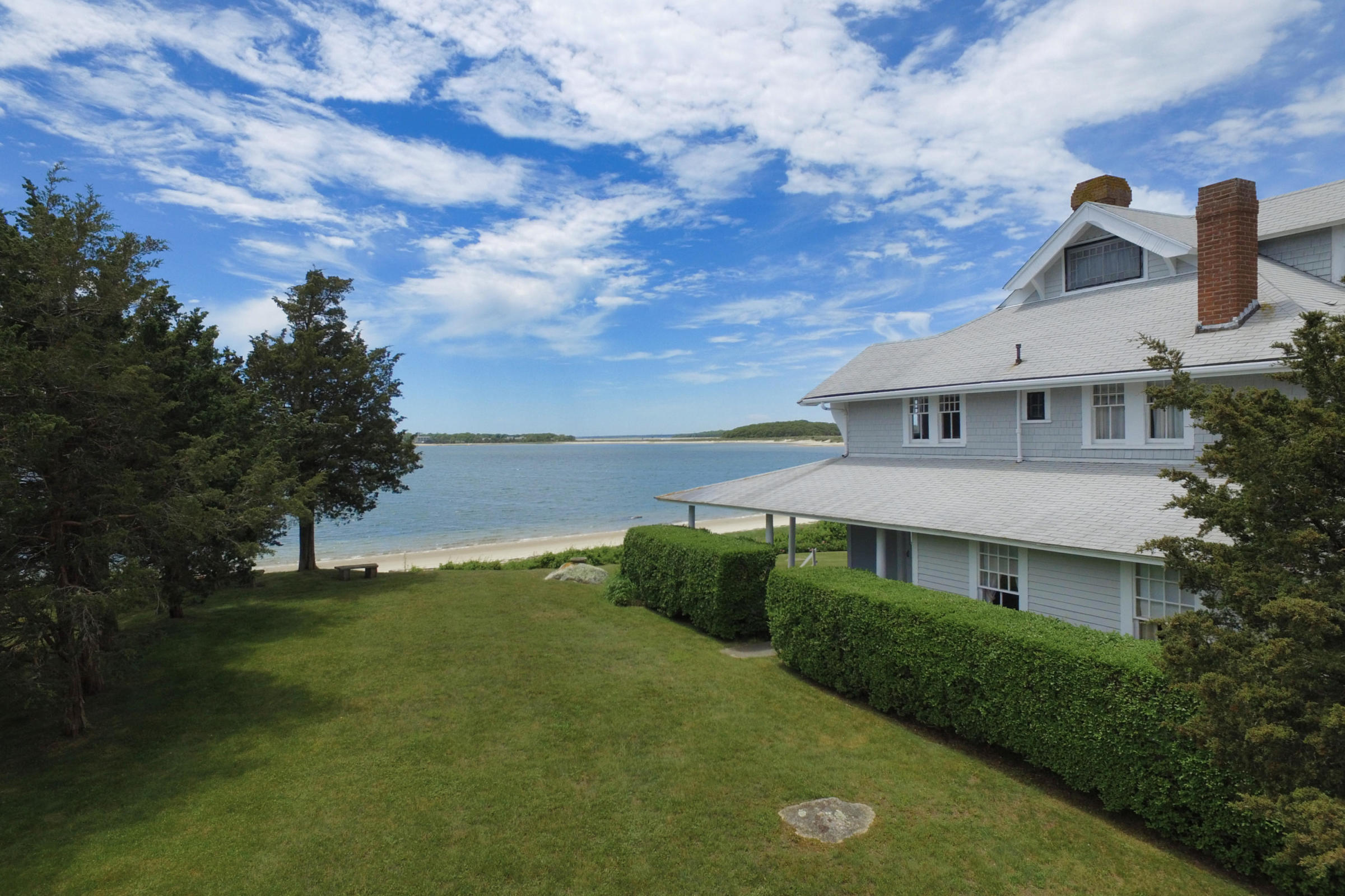 96 Rocky Point Road Bourne, MA 02532 - Photo 3 of 28 a view of a big house with a big yard and large tree
