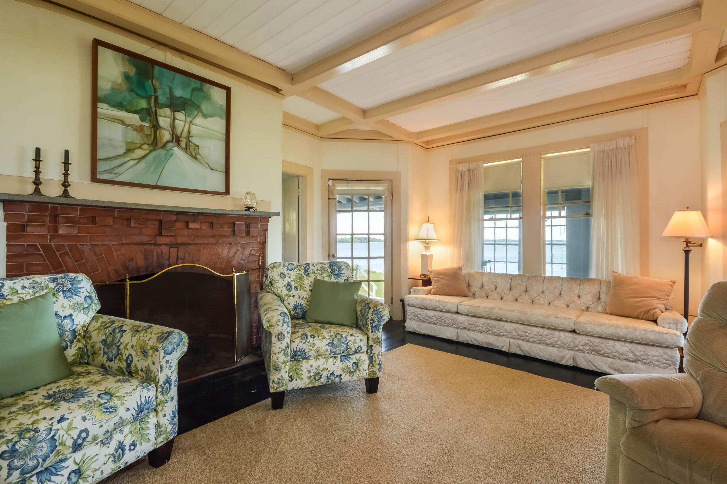 96 Rocky Point Road Bourne, MA 02532 - Photo 10 of 28 a living room with furniture and a fireplace