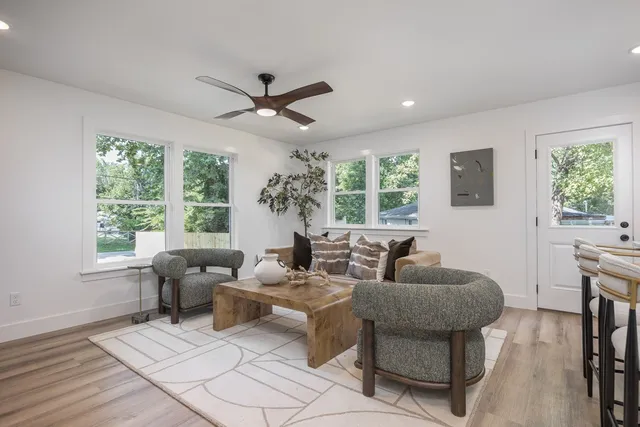 a living room with furniture and a large window