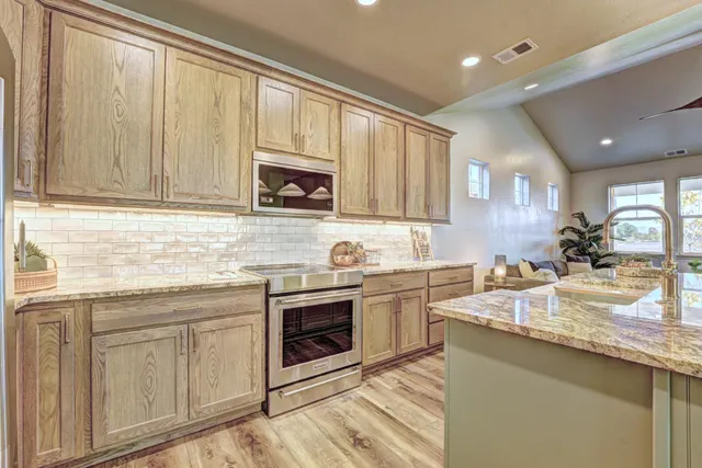 a kitchen with sink cabinets and window