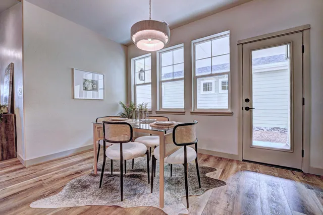 a view of a livingroom with furniture window and wooden floor