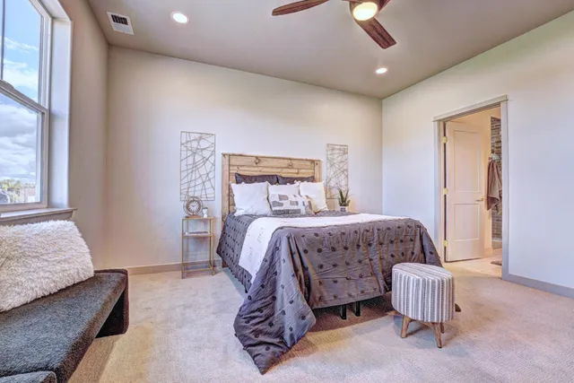 a bedroom with a bed and a couch