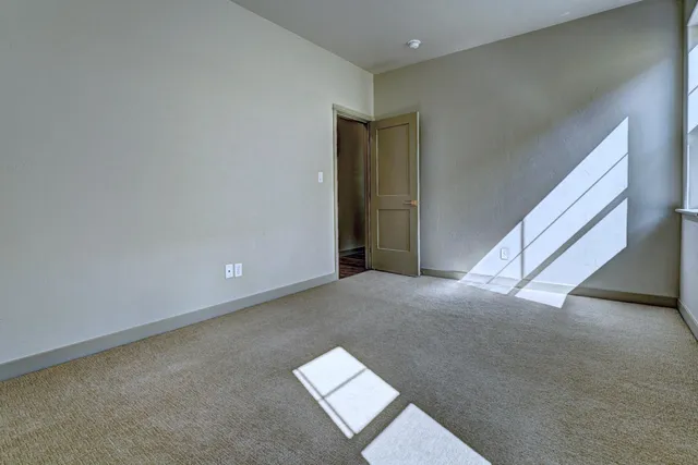 a view of a hallway with staircase