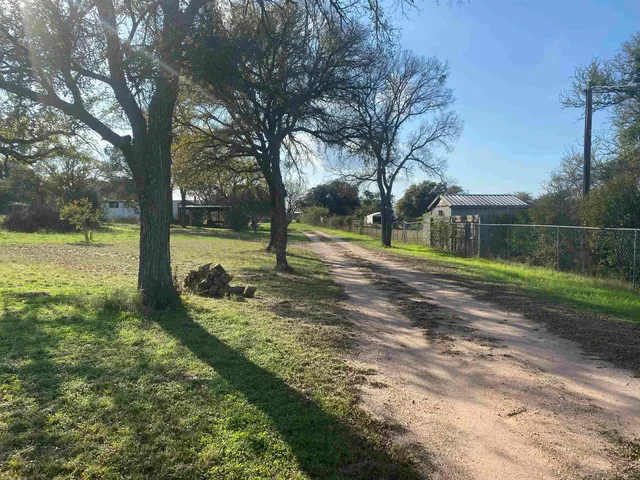 a view of a lake with a big yard