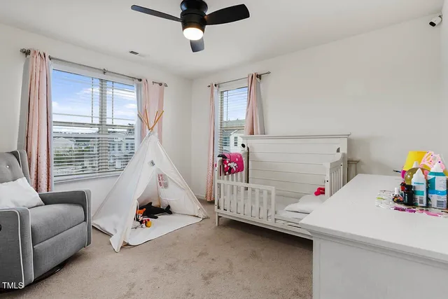 a bedroom with furniture and a window