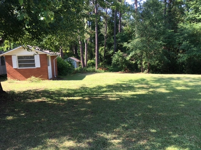 301 Langston Road Perry, GA 31069 - Photo 22 of 30 a view of a house with a yard