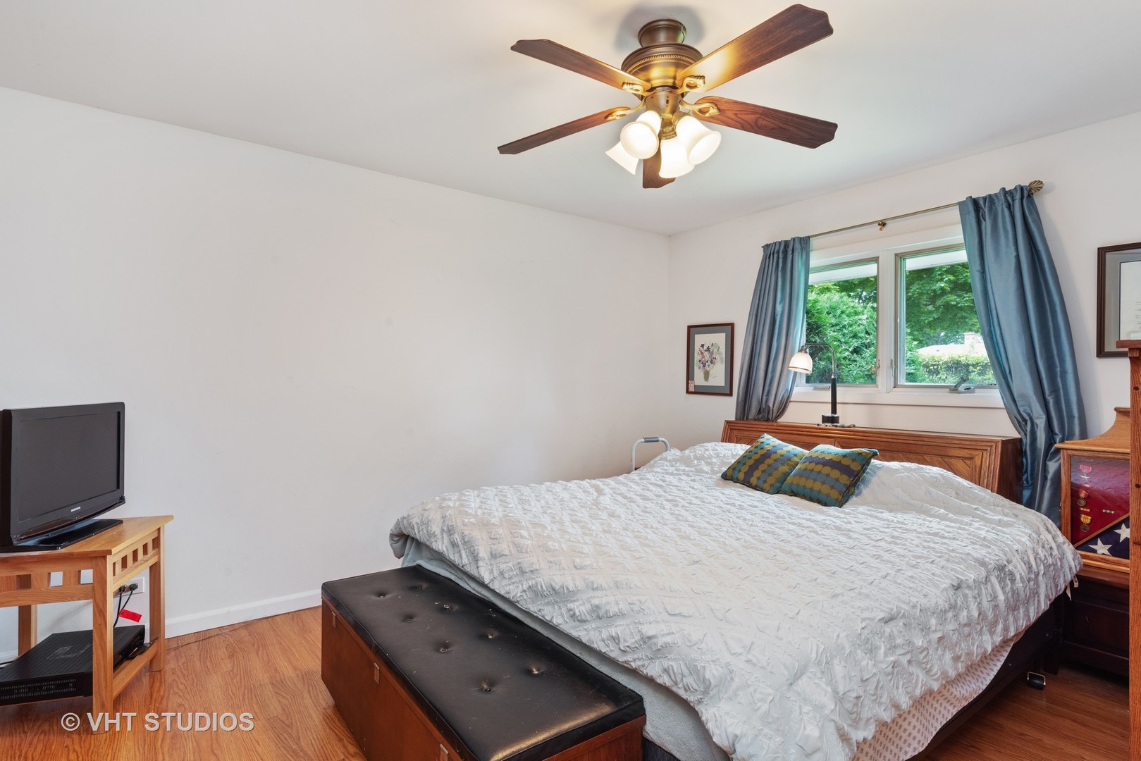540 Briarhill Road Glenview, IL 60025 - Photo 13 of 19 a bedroom with a bed and a flat screen tv
