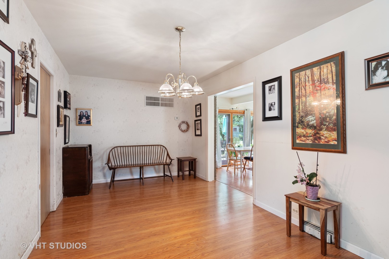 540 Briarhill Road Glenview, IL 60025 - Photo 3 of 19 a view of a livingroom with furniture a chandelier and wooden floor